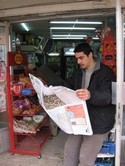 A man reads a Jordanian newspaper
